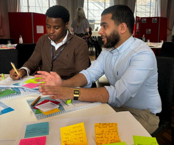 Kelechi Alozie speaking to Dr Qasim at the AI Youth Council